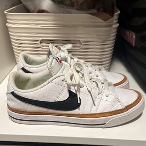 Nike White Sneakers with Black Swoosh and Brown Trim